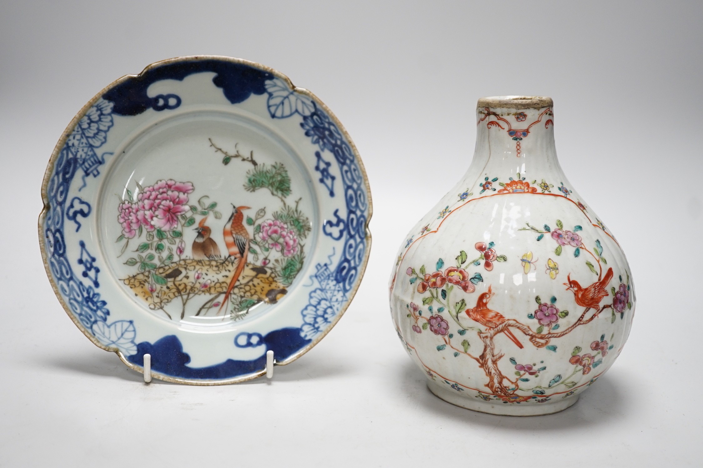 A Chinese Kangxi period clobbered bottle vase, reduced, height 29.5cm, and a Chinese plate, vase 18cms high